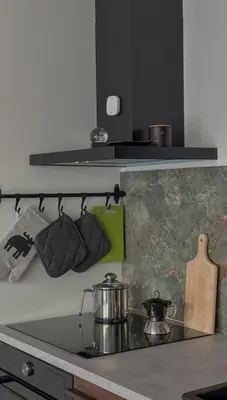 a kitchen with a stove with a pot and pans at Viktorka in Prague