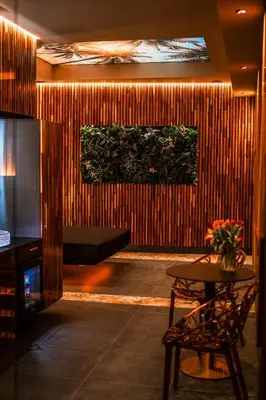 a room with a wooden wall with a table at Coco Suite Private Spa and Jacuzzi Prague Center in Prague
