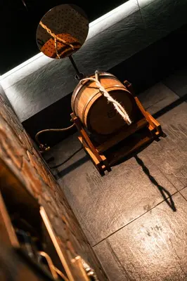 an oldasket sitting on the floor next to at Coco Suite Private Spa and Jacuzzi Prague Center in Prague