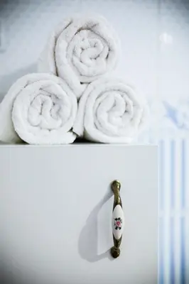 a pile of towels sitting next to a toothbrush at Apartments U Krále Brabantského in Prague
