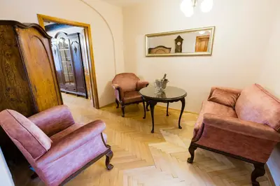 a living room with two chairs and a table at Apartments U Krále Brabantského in Prague