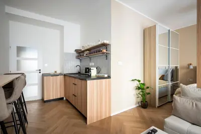 a small kitchen with a counter and a microwave at Place of Grace - Anděl 1 min to subway in Prague