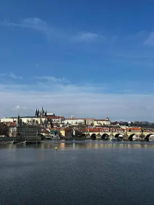 a city with a bridge over a body of water at Design Loft near National Theatre in Prague