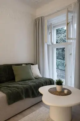 a living room with a couch and a table at Design Loft near National Theatre in Prague