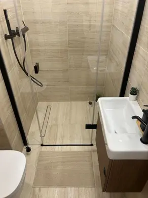a bathroom with a shower and a sink at Design Loft near National Theatre in Prague