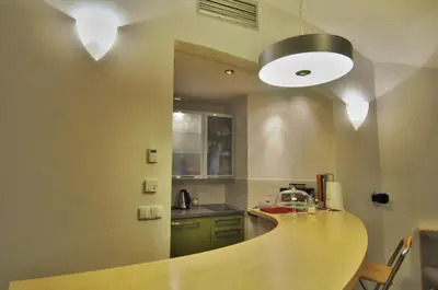 a kitchen with a wooden counter top in a room at Apartment Trziste in Prague