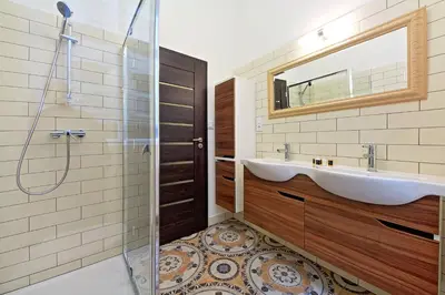 a bathroom with a sink and a shower at DeLuxe Apartment in Prague