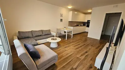 a living room with a couch and a table at Klamovka stylish Apartment by Rentez in Prague