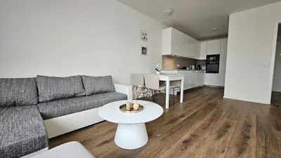 a living room with a couch and a table at Klamovka stylish Apartment by Rentez in Prague