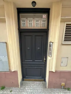 a black door with a window on a building at Kroftova12 in Prague