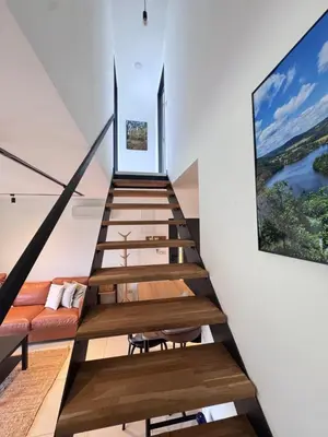 a staircase leading up to a house with a living room at Green Resort Slapy