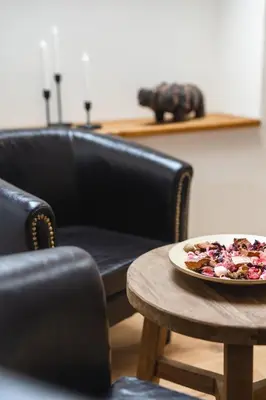 a plate of food on a table next to a couch at Farma Mlýn Drásov in Drásov