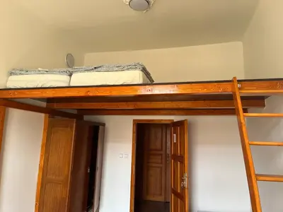 a bunk bed in a room with a bunk bed in a room at Central cozy rooms Soukenická S36 in Prague