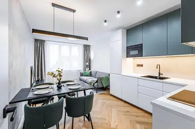 a kitchen and dining room with a table and chairs at Under the Airship, Prague in Prague