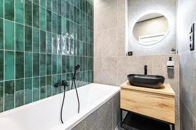 a bathroom with a sink and a bath tub at Under the Airship, Prague in Prague