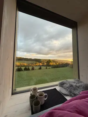 a room with a window with cups on a table at Glamping od Amy in Ohrazenice