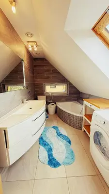 a bathroom with a sink and a toilet and a tub at Modern house with pool, 20 minutes from the center of Prague in Prague