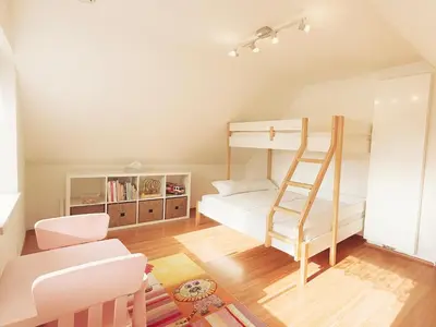 a bedroom with a bunk bed and a ladder at Modern house with pool, 20 minutes from the center of Prague in Prague
