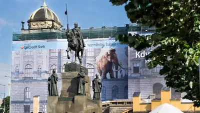 a building with a statue in front of it at Black & White Apartment Prague by Wenceslas Square and Muzeum in Prague