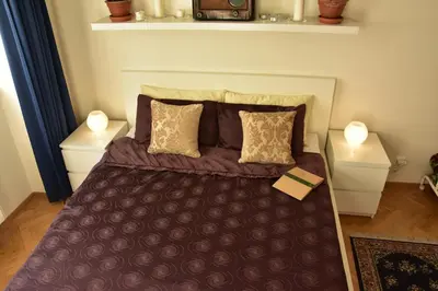 a bedroom with a large bed with two night stands at Victoria Design Stays - Apartment Slavojova in Prague