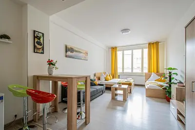 a living room with a couch and a table at City Center Apartments near Synagogue in Prague