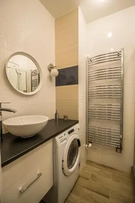 a bathroom with a washing machine and a sink at City Center Apartments near Synagogue in Prague