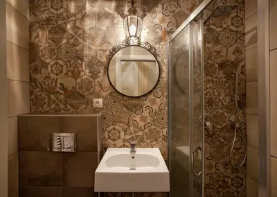 a bathroom with a sink and a mirror at Igor and David Apartments in Prague