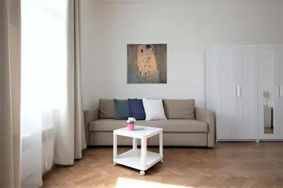 a living room with a couch and a table at Angel City Aparthotel in Prague