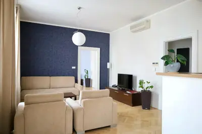 a living room with a couch and two chairs at Rezidence Ostrovní in Prague