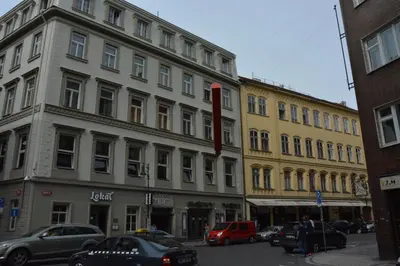 a large building on a city street with parked cars at Apartment Aida in Prague