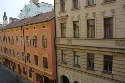 two buildings next to each other on a street at Apartment Aida in Prague