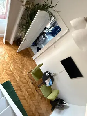 an overhead view of a living room with green chairs at Apartment Siroka 14 in Prague