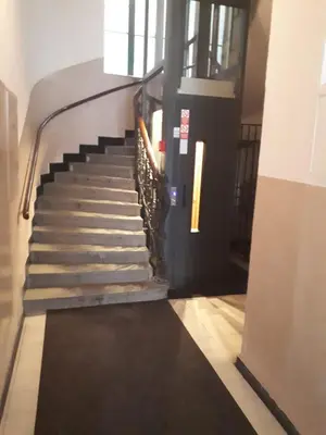 a staircase in a building with a black carpet at Apartment Josef in Prague