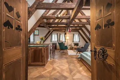 an open door to a room with wooden ceilings at Residence U Mecenáše in Prague