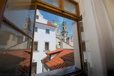 a view from a window of a building with turrets at Residence U Mecenáše in Prague