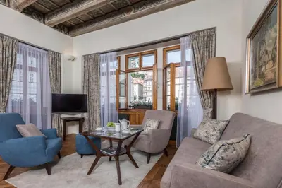 a living room with a couch and a table at Residence U Mecenáše in Prague