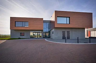 a building with a brick driveway in front of it at MG Restaurace/Luxury Apartments in Mladá Boleslav