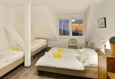 a bedroom with two beds and a window at Pension 101 Dubá in Dubá