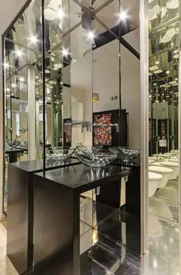 a room with glass bowls on a counter with mirrors at Historic Centre Apartments VI in Prague