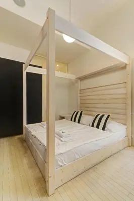 a bedroom with a bunk bed with white sheets at Historic Centre Apartments VI in Prague