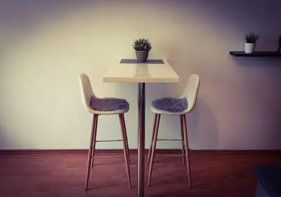 a cup of coffee sitting on a table with cookies at Prague 7days Apartments - FREE PARKING in Prague
