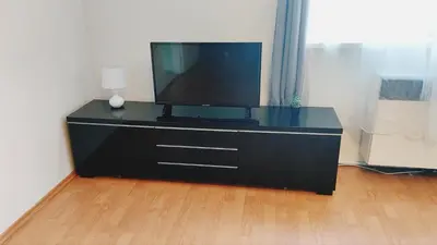 a bedroom with a bed with two green pillows on it at Prague 7days Apartments - FREE PARKING in Prague