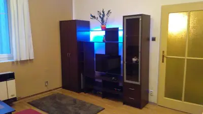 a bedroom with a large bed with blue pillows at Prague 7days Apartments - FREE PARKING in Prague
