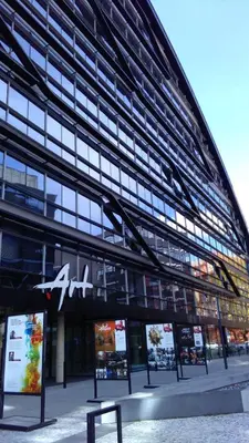 a large building with a sign in front of it at Prague 7days Apartments - FREE PARKING in Prague