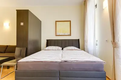 a bedroom with a large bed in a room at Hálkova Studio in Prague