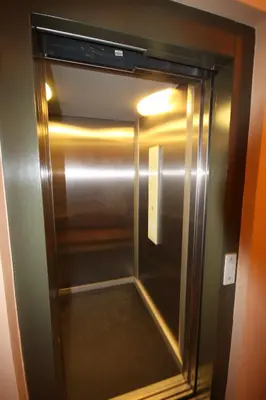 a stainless steel refrigerator in a room at Hálkova Studio in Prague