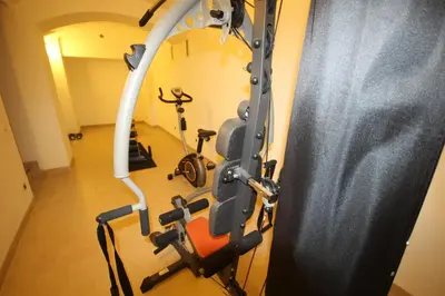 a gym with exercise equipment in a room at Hálkova Studio in Prague