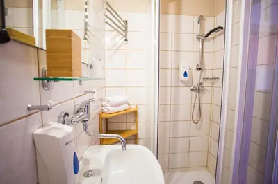 a bathroom with a shower and a sink at Penzion Ctrnactka in Rataje nad Sázavou