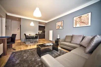 a living room with a couch and a table at Art Residence Krocinova in Prague