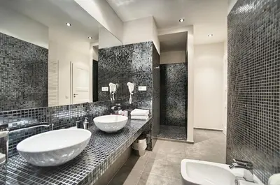 a black and white bathroom with two sinks and a shower at Art Residence Krocinova in Prague